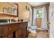 Functional bathroom featuring a vanity with ample storage, a standard toilet, and a shower with a curtain at 3265 W Innes St, Salisbury, NC 28144