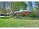 Charming brick ranch-style home with well-maintained landscaping and mature trees in a peaceful neighborhood at 3265 W Innes St, Salisbury, NC 28144