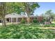 Charming brick home with a well-manicured lawn, a cozy porch, and mature trees creating a welcoming curb appeal at 3265 W Innes St, Salisbury, NC 28144