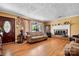 Inviting living room with hardwood floors, a brick fireplace, and large windows, providing ample natural light at 3265 W Innes St, Salisbury, NC 28144