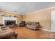Comfortable living room with hardwood floors, a brick fireplace, and neutral tones, creating a warm and inviting space at 3265 W Innes St, Salisbury, NC 28144