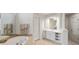 Bright bathroom featuring large soaking tub and white cabinetry at 4027 Wallbrook Dr, Matthews, NC 28105
