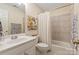 Bathroom featuring shower and neutral countertops and cabinetry at 4027 Wallbrook Dr, Matthews, NC 28105