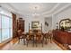 Elegant dining room featuring a chandelier, hardwood floors, and classic furnishings at 4027 Wallbrook Dr, Matthews, NC 28105