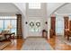 Spacious foyer featuring hardwood floors, high ceilings, double doors, and lots of natural light at 4027 Wallbrook Dr, Matthews, NC 28105