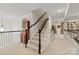 Carpeted staircase and hallway leading to bookshelf at 4027 Wallbrook Dr, Matthews, NC 28105