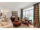 Inviting living room with hardwood floors, stylish furniture, and large windows with custom drapes at 4027 Wallbrook Dr, Matthews, NC 28105