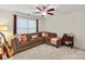Sitting area with comfortable L shaped couch with neutral carpet and natural light at 4027 Wallbrook Dr, Matthews, NC 28105