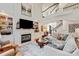 Comfortable living room with a fireplace, built-in shelves, a large painting, and a staircase leading to an upper level at 4027 Wallbrook Dr, Matthews, NC 28105