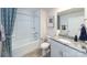 Pristine bathroom featuring modern fixtures, a sleek vanity, and a combined shower and tub at 4372 Bronze Blvd, Sherrills Ford, NC 28673