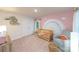 Charming Bedroom featuring a rainbow wall design, a cozy crib, and comfortable seating at 4372 Bronze Blvd, Sherrills Ford, NC 28673