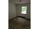 Vacant bedroom with a window overlooking the backyard at 4406 Valeview Ln, Charlotte, NC 28269