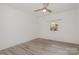 Bedroom featuring a ceiling fan, laminate flooring and a window at 500 3Rd St, Stanley, NC 28164
