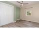 Bedroom featuring a closet, laminate flooring, window, and modern paint at 500 3Rd St, Stanley, NC 28164