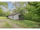 Ranch home nestled on a grassy lot with mature trees at 500 3Rd St, Stanley, NC 28164