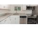 Close up of kitchen with granite countertops and stainless steel appliances at 500 3Rd St, Stanley, NC 28164