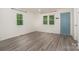 Bright living room with modern floors and an inviting blue door at 500 3Rd St, Stanley, NC 28164