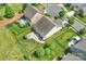 Aerial view of home with a fenced backyard, patio, and outdoor fire pit at 505 Chamberlain Ct, Mcadenville, NC 28101
