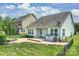 Backyard of the home shows a fire pit, patio, and green lawn at 505 Chamberlain Ct, Mcadenville, NC 28101