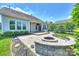 Backyard showcasing an outdoor firepit, fenced yard, and exterior of the home at 505 Chamberlain Ct, Mcadenville, NC 28101
