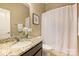 Bathroom featuring granite countertop, framed mirror, shower and vanity at 505 Chamberlain Ct, Mcadenville, NC 28101