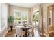 Cozy breakfast nook with large windows offering views of the lush backyard and access to the patio at 505 Chamberlain Ct, Mcadenville, NC 28101