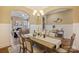 Elegant dining room featuring modern decor, arched doorways, and a chandelier at 505 Chamberlain Ct, Mcadenville, NC 28101