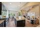 Open kitchen with stainless appliances overlooking the living area with fireplace and breakfast nook at 505 Chamberlain Ct, Mcadenville, NC 28101