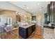 Spacious kitchen featuring granite countertops, stainless steel appliances, and hardwood flooring at 505 Chamberlain Ct, Mcadenville, NC 28101