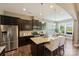 Modern kitchen with stainless steel appliances, granite countertops, and breakfast bar seating at 505 Chamberlain Ct, Mcadenville, NC 28101