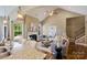 Bright and airy living space with a fireplace, seamless transition to the kitchen, and vaulted ceilings at 505 Chamberlain Ct, Mcadenville, NC 28101