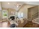 Cozy living room with fireplace and staircase, showcasing a comfortable and inviting space at 505 Chamberlain Ct, Mcadenville, NC 28101