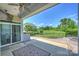 Covered patio with ceiling fan overlooks a backyard fire pit and green space at 505 Chamberlain Ct, Mcadenville, NC 28101