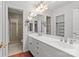 Elegant bathroom featuring a double sink vanity, a large mirror, and a glass-enclosed shower at 5306 Sandtrap Ln, Charlotte, NC 28226