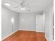 A well lit bedroom with hardwood floors, ceiling fan, and recessed lighting at 5306 Sandtrap Ln, Charlotte, NC 28226