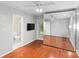 Bedroom with large mirrored closet, hardwood floors, and access to an ensuite bathroom at 5306 Sandtrap Ln, Charlotte, NC 28226