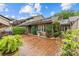 Charming brick courtyard showcasing lush landscaping and well-maintained exterior details at 5306 Sandtrap Ln, Charlotte, NC 28226