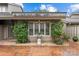 Beautiful outdoor space with lush landscaping, elegant stone urn, and brick pavers at 5306 Sandtrap Ln, Charlotte, NC 28226