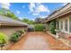 Beautiful home featuring a spacious brick yard, mature landscaping, a grill, and a detached garage at 5306 Sandtrap Ln, Charlotte, NC 28226