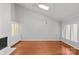 Bright living room featuring a fireplace, built-in cabinets, and hardwood flooring at 5306 Sandtrap Ln, Charlotte, NC 28226