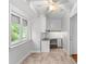 Bright office nook with built-in desk, cabinets, and natural light from a window at 5306 Sandtrap Ln, Charlotte, NC 28226