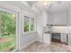 Office space with built-in desk and access to the outside, providing a bright workspace at 5306 Sandtrap Ln, Charlotte, NC 28226