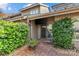Cozy brick patio with an outdoor entertainment area surrounded by beautiful landscaping and natural light at 5306 Sandtrap Ln, Charlotte, NC 28226
