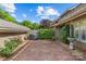 Exterior view of a brick patio, perfect for outdoor gatherings with privacy and lush landscaping at 5306 Sandtrap Ln, Charlotte, NC 28226