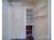 Utility area in basement with exposed shelving and plumbing, suitable for maintenance access at 610 N Pine Ln, Wadesboro, NC 28170