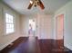 Bedroom showcasing hardwood floors, a closet, and multiple entryways providing easy access to the home at 610 N Pine Ln, Wadesboro, NC 28170