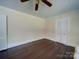 Bedroom with gleaming hardwood floors, and ample storage offered by two spacious closets at 610 N Pine Ln, Wadesboro, NC 28170
