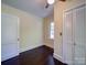 Bright bedroom boasts a window, closet space, and sleek hardwood floors at 610 N Pine Ln, Wadesboro, NC 28170