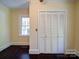Inviting bedroom showcasing hardwood floors, natural light, and closet at 610 N Pine Ln, Wadesboro, NC 28170