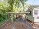 Exterior shot of a carport with foliage in the background at 610 N Pine Ln, Wadesboro, NC 28170